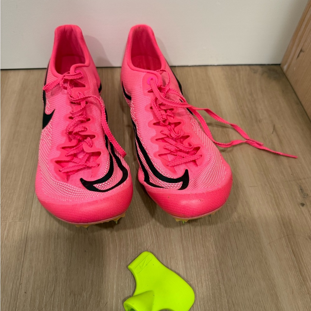 Women’s 8.5 Nike Women's Pink and Black track shoes